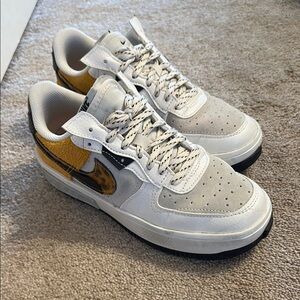 Nike Women’s White and Gold Sneakers